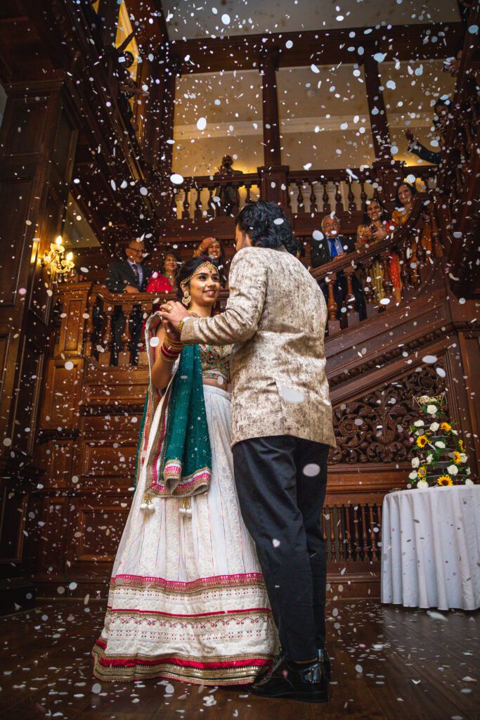 Asian Wedding First Dance with Confetti raining down, photograph taken whilst working with Memories Made Photography.